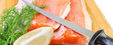 fishing fillet knife cutting salmon