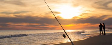 surf fishing rods on the beach