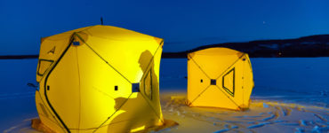 ice fishing shelter on a frozen lake