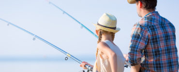 people using travel fishing rods on vacation