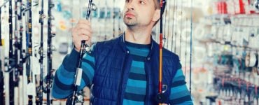 Man Choosing a fishing rod