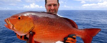 florida fisherman holding a snapper