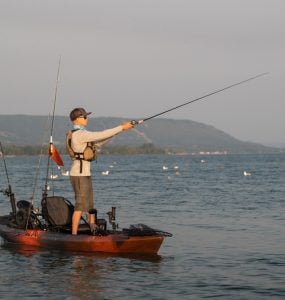 Man Kayak Fishing at Sunrise