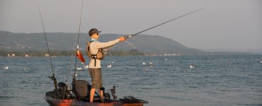 Man Kayak Fishing at Sunrise