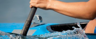 person paddling a kayak