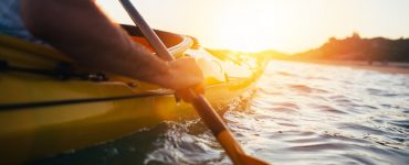 person paddling a kayak