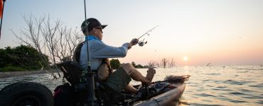 person in 10 foot fishing kayak