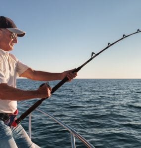 fisherman fishing from the charter boat