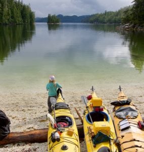 3 kayaks packed for an overnight trip