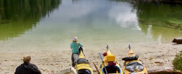3 kayaks packed for an overnight trip