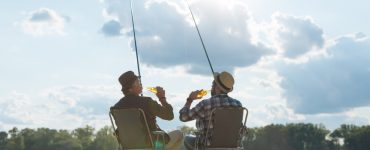 two people fishing and drinking beer
