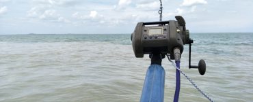 an electric fishing reel casted out