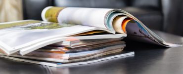 a stack of fishing magazines