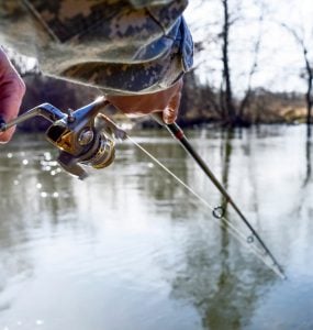 person fishing with monofilament line