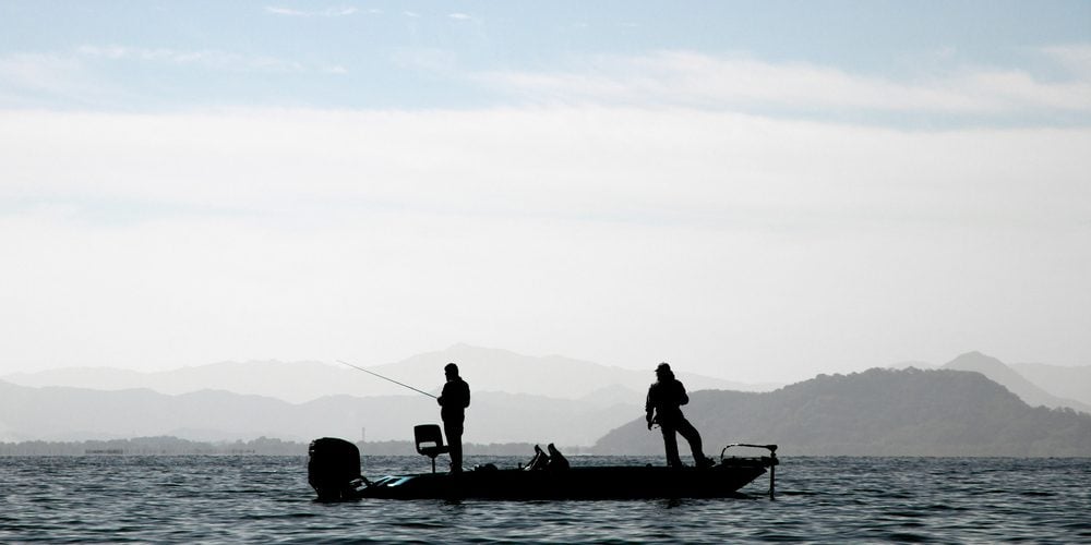 two anglers on a fishing boat