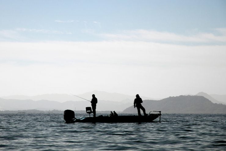two anglers on a fishing boat