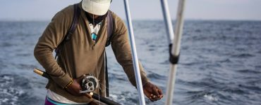 man fishing on a boat